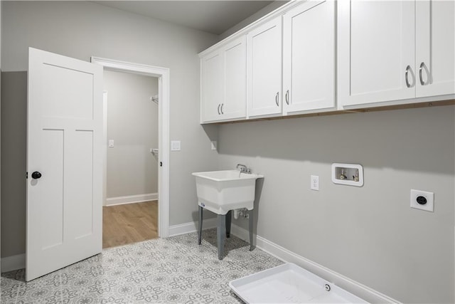 laundry area with cabinets, washer hookup, and hookup for an electric dryer