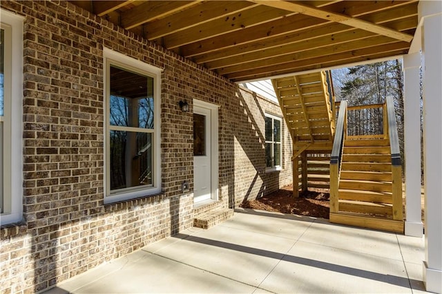 doorway to property featuring a patio