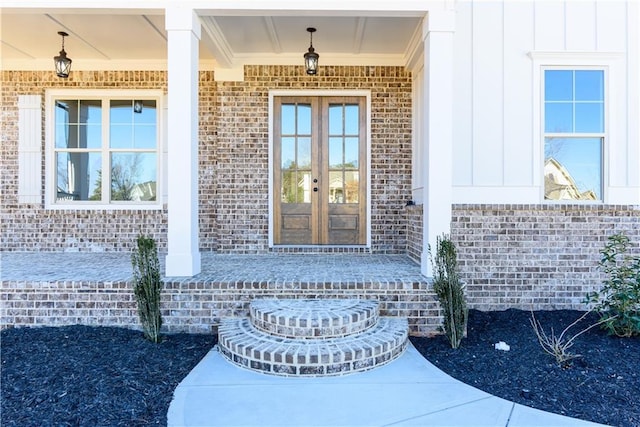 view of exterior entry featuring french doors