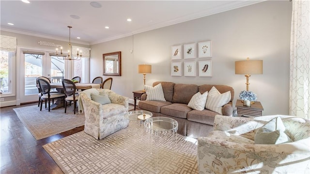 living area with recessed lighting, a notable chandelier, dark wood finished floors, and ornamental molding