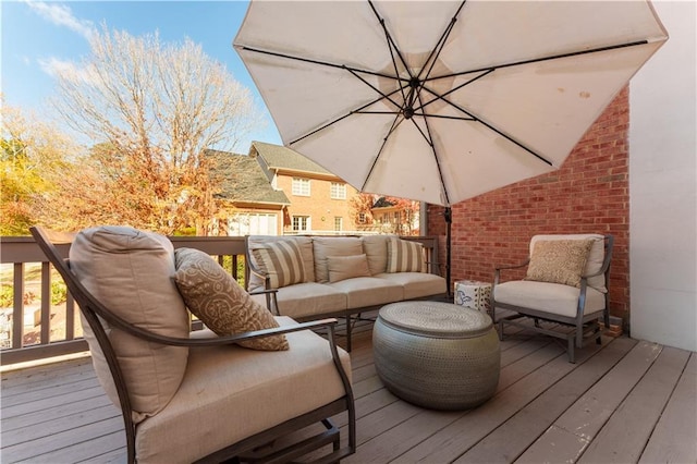 wooden terrace featuring an outdoor hangout area