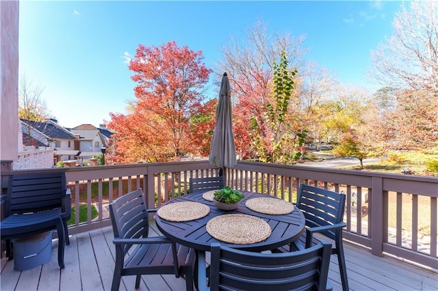 wooden deck featuring outdoor dining space