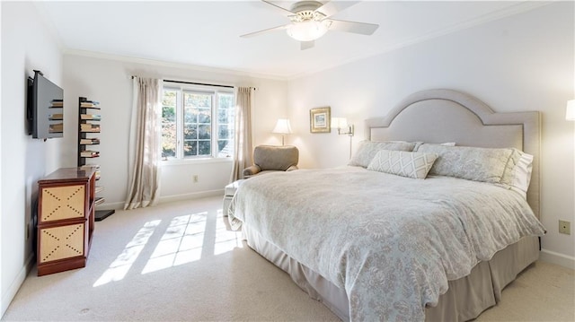 bedroom with ceiling fan, ornamental molding, baseboards, and light carpet