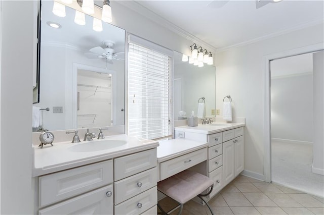 full bath with ornamental molding, tile patterned flooring, baseboards, ceiling fan, and vanity