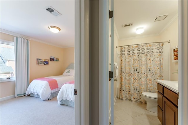 ensuite bathroom featuring tile patterned floors, visible vents, connected bathroom, and ornamental molding