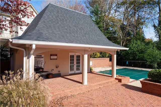 view of swimming pool with a patio, a fenced in pool, french doors, and fence