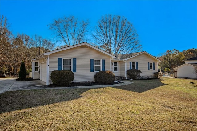 single story home with a garage and a front lawn