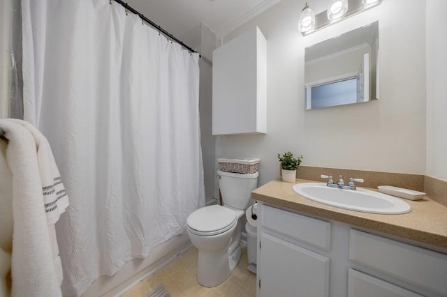 bathroom featuring ornamental molding, vanity, and toilet