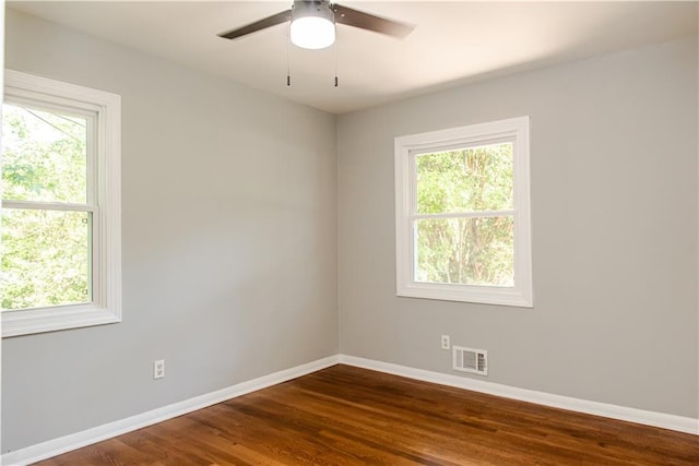 4339 Sasanqua Ct, Tucker, GA 30084 - unfurnished room with baseboards, healthy amount of natural light, and dark wood-style floors