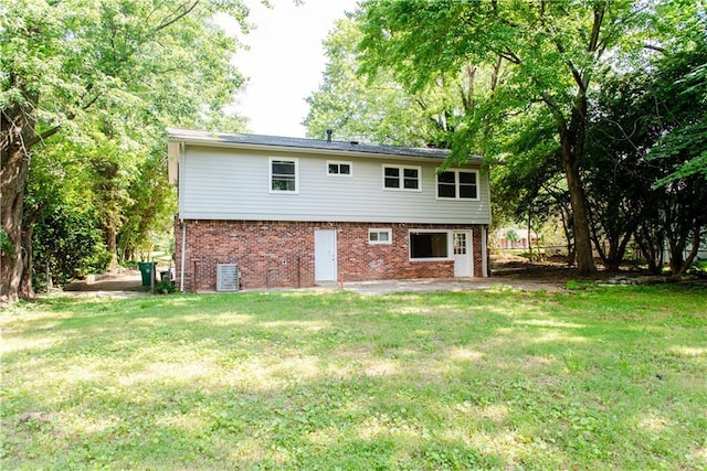 4339 Sasanqua Ct, Tucker, GA 30084 - back of house featuring brick siding, cooling unit, and a yard