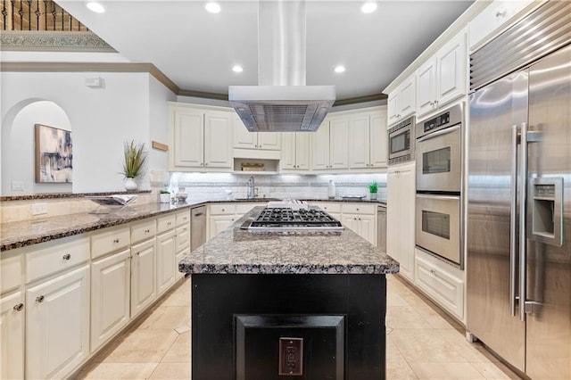 8370 Royal Melbourne Way, Duluth, GA 30097 - kitchen with built in appliances, ornamental molding, light tile patterned flooring, recessed lighting, and backsplash