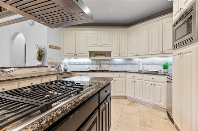 8370 Royal Melbourne Way, Duluth, GA 30097 - kitchen featuring stainless steel appliances, extractor fan, dark stone counters, and light tile patterned flooring