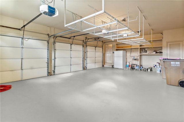 8370 Royal Melbourne Way, Duluth, GA 30097 - garage with freestanding refrigerator and a garage door opener