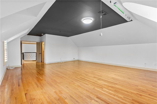 8370 Royal Melbourne Way, Duluth, GA 30097 - additional living space featuring vaulted ceiling and light wood-style flooring