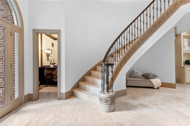 8370 Royal Melbourne Way, Duluth, GA 30097 - tiled foyer featuring a towering ceiling and stairway