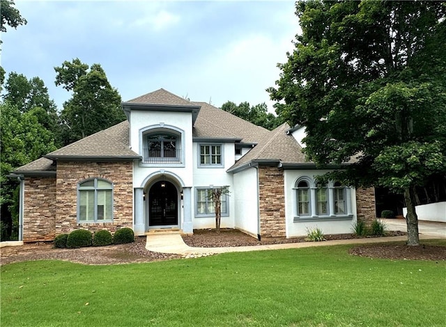 view of front facade featuring french doors and a front lawn