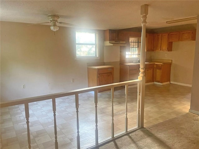 interior space featuring ceiling fan