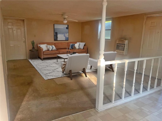 living room with heating unit and ceiling fan