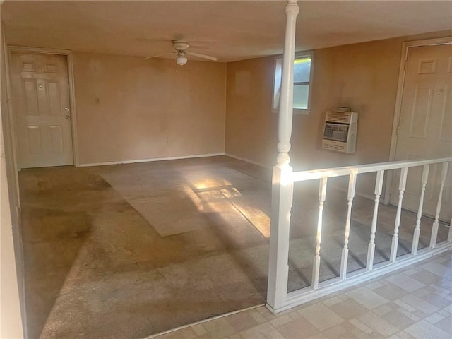 basement featuring heating unit and ceiling fan