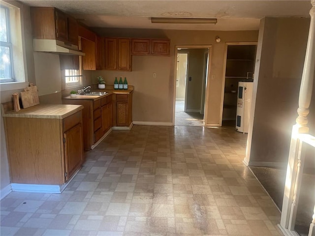 kitchen with electric water heater and sink