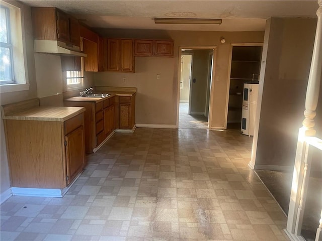 kitchen featuring sink and water heater