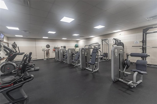 gym with a drop ceiling