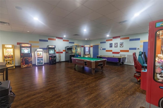 recreation room with visible vents, wood finished floors, and a paneled ceiling