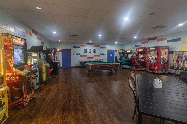 recreation room featuring a paneled ceiling, visible vents, recessed lighting, and wood finished floors