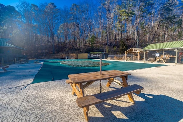 view of swimming pool with a patio area, fence, a fenced in pool, and a gazebo