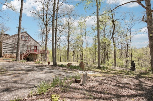 8145 Stone Hill Rd, Cumming, GA 30028 - view of yard featuring a wooden deck and stairway