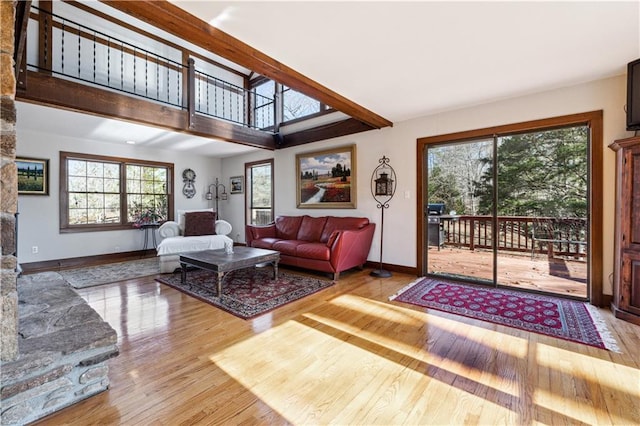 8145 Stone Hill Rd, Cumming, GA 30028 - living area featuring wood finished floors, healthy amount of natural light, and baseboards