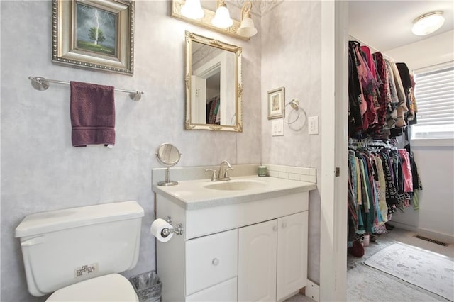 8145 Stone Hill Rd, Cumming, GA 30028 - bathroom with vanity and toilet