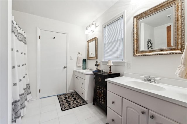 8145 Stone Hill Rd, Cumming, GA 30028 - bathroom with two vanities and tile patterned flooring