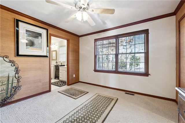 8145 Stone Hill Rd, Cumming, GA 30028 - unfurnished bedroom featuring carpet floors, ornamental molding, baseboards, connected bathroom, and a ceiling fan