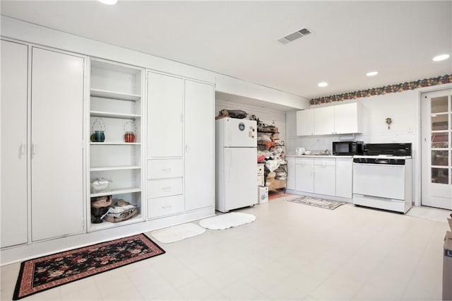 8145 Stone Hill Rd, Cumming, GA 30028 - kitchen featuring white appliances, white cabinets, recessed lighting, and open shelves