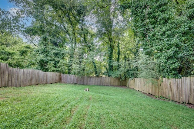 view of yard with a fenced backyard