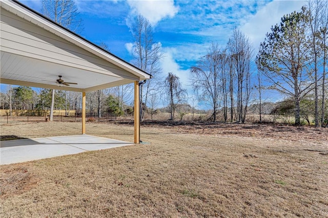 view of yard featuring a patio area and a ceiling fan