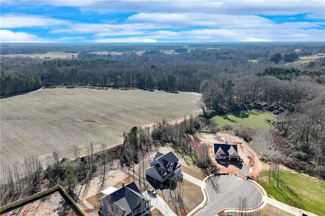 birds eye view of property with a rural view and a view of trees