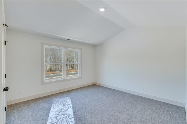 unfurnished room with recessed lighting, baseboards, lofted ceiling, and carpet floors