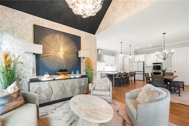 living room featuring a notable chandelier, crown molding, and hardwood / wood-style floors