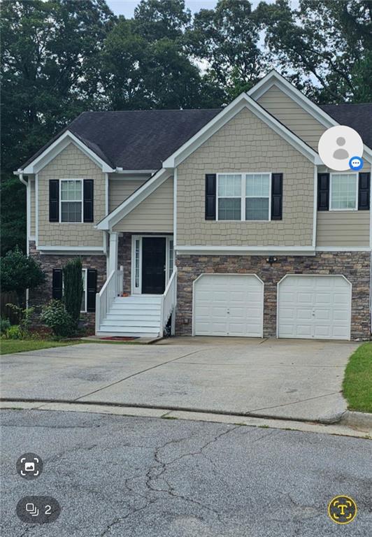 view of front of property featuring a garage