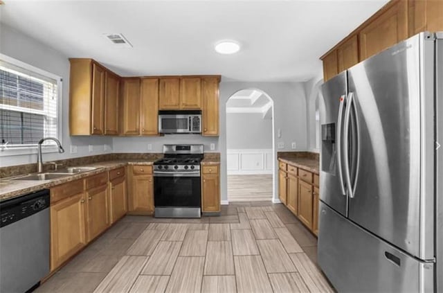 kitchen featuring stainless steel appliances and sink