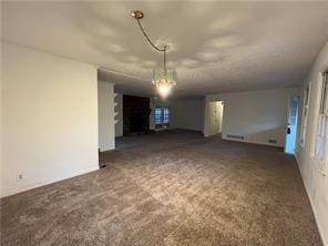 unfurnished room featuring dark colored carpet