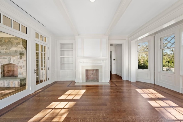 unfurnished sunroom featuring a fireplace and beamed ceiling