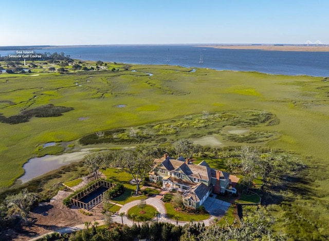 drone / aerial view with a rural view and a water view