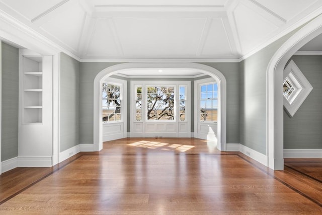 foyer featuring hardwood / wood-style floors and crown molding