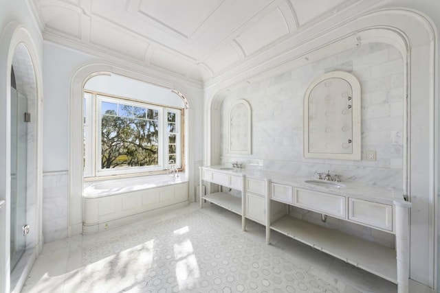 bathroom with vanity and a tub to relax in