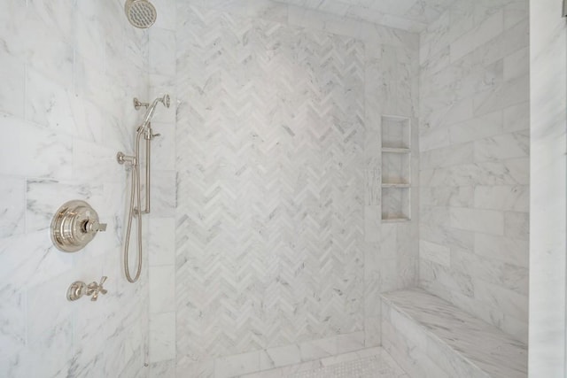 bathroom featuring a tile shower