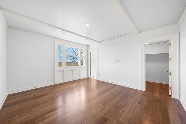 spare room with dark hardwood / wood-style flooring and ornamental molding