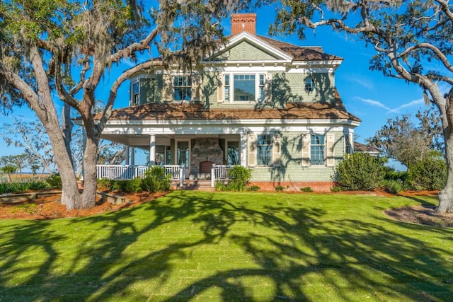 view of front of house featuring a front lawn and a porch